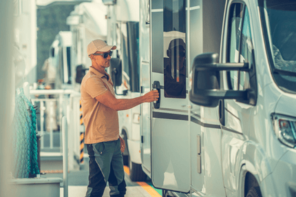 A man opening a door to a motorhome on a ferry